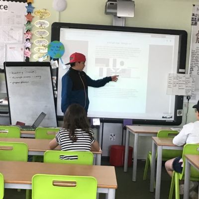 Gabriel (Year 6 pupil and North Beckton Primary School HeadStart Champion) delivering a special presentation to Key Stage 1 and Key Stage 2 pupils about Victory in Europe Day (VE Day).